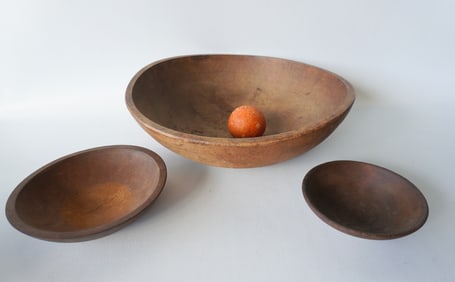 Three primitive treenware bowls including: A turned maple bowl with tooled rim, in very good