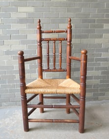 A custom made oak Brewster style chair with rush seat, late 19th to early 20th century in the