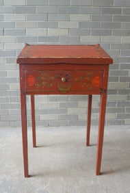 A very fine hand painted country store desk with single drawer and tapered legs. Decorated with