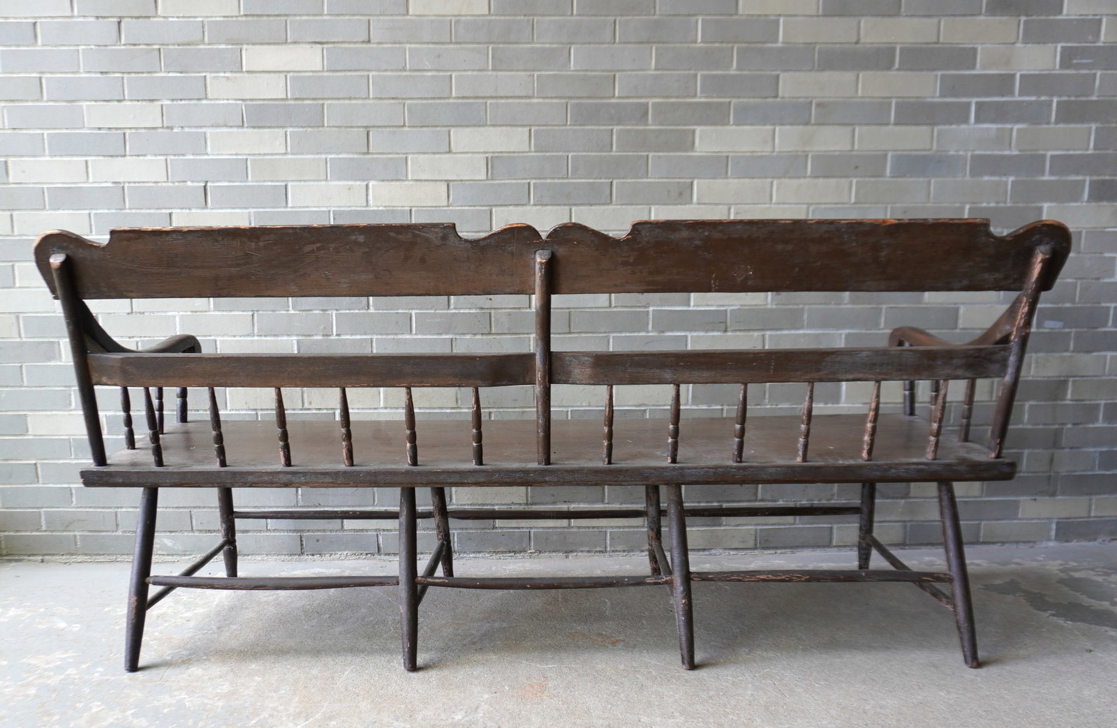 A Sheraton country bench with half-spindles and wide plank seat, early 19th century, probably: A Sheraton country bench with half-spindles and wide plank seat, early 19th century, probably Pennsylvania. The back splat hand decorated with baskets of fruit flanking a hand painting of a sprig of f