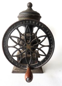 Cast iron coffee mill, single wheel, signed "The Swift / Lane Brothers Poughkeepsie N.Y.". Black