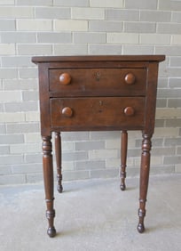 A Sheraton 2 drawer work table in cherry and other hardwoods, having 2 drawers and turned legs,