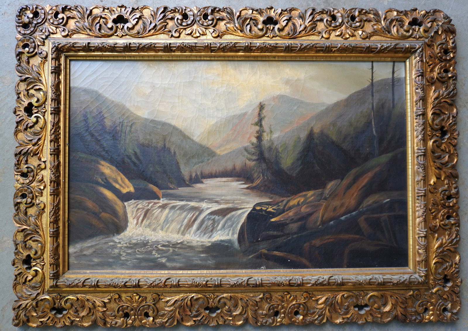 O/C Country landscape, probably Adirondack area, depicting stream with waterfall flowing through: O/C Country landscape, probably Adirondack area, depicting stream with waterfall flowing through forest. Housed in original gilt gesso frame, circa 1880-90. ADS iron bracket on reverse with patent dat