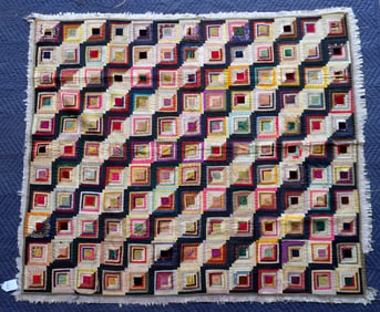 A small graphic silk Log Cabin pattern quilt, 19th century. Some fraying around the applied border,