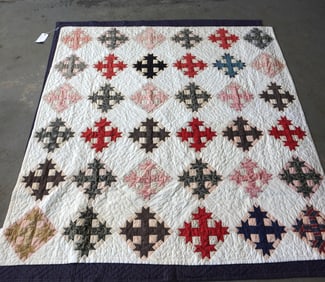 A patchwork quilt, stars in a diamond pattern, very good condition. Early 20th century. Measures 70"