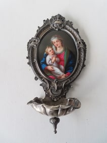 A beautiful high quality oil on porcelain of Madonna and Child, housed in a silver frame with holy