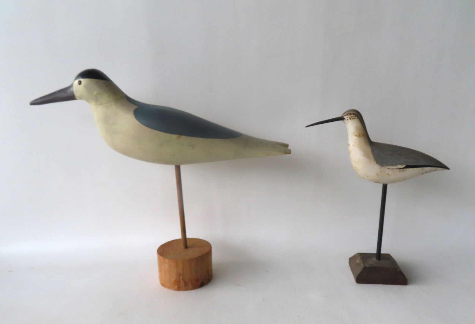 Two carved sea birds, both circa 1960-80. The first a folky seagull in original paint with glass: Two carved sea birds, both circa 1960-80. The first a folky seagull in original paint with glass eyes, small paint crack in neck, else very good condition - 14 1/4"L x 4 1/2"H; and the second a shoreb
