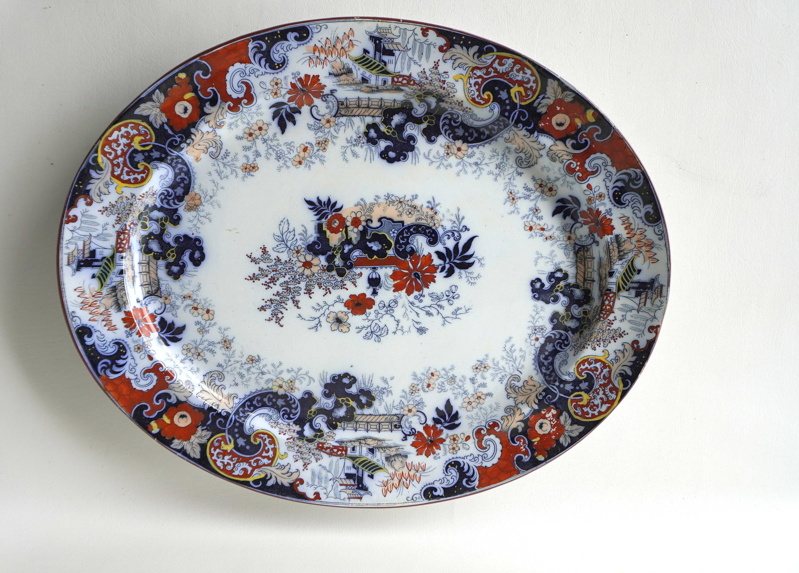 A large Staffordshire Gaudy Dutch pattern porcelain platter, circa 1830 - some use wear to paint: A large Staffordshire Gaudy Dutch pattern porcelain platter, circa 1830 - some use wear to paint along the top edge, else very good condition with no damage or repairs - 21 3/4" x 17 3/4"; sold with 2