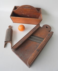 Three country wooded kitchen collectibles including: A fine butternut cutlery box with tight