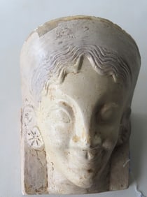 An Egyptian revival plaster death mask of lady, possibly a queen, hand painted in white and light