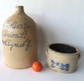 Two stoneware crocks with damage: The first a script jug marked in cobalt blue ""J.C. Ficken & Co. /