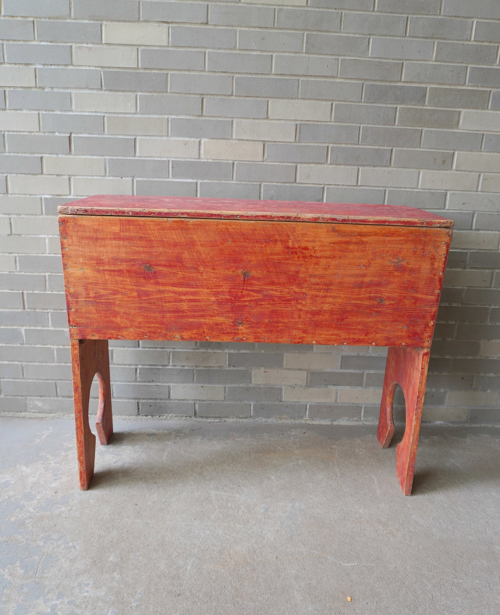 A primitive 2 part grain or dough box, 19th century, with key-hole cut-outs on sides, traces of: A primitive 2 part grain or dough box, 19th century, with key-hole cut-outs on sides, traces of original red paint. Good structural condition. Measures 4 1/4"W x 15 1/2"D x 33 1/4"H.
