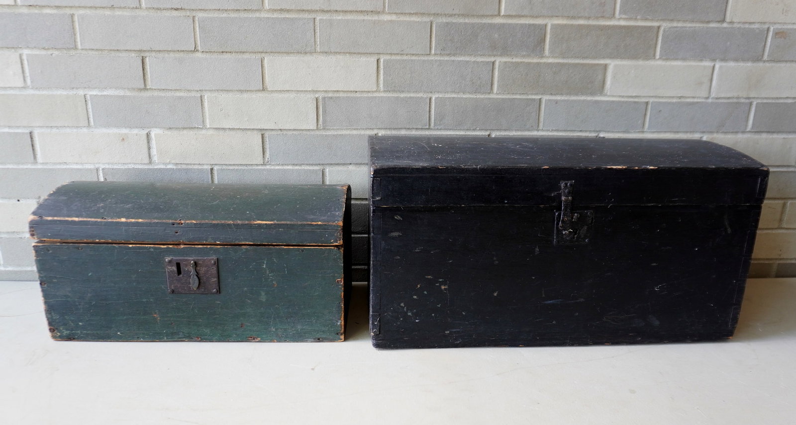 Two dome top boxes, mid 19th century. The smaller in original green paint, repair to hinged area,: Two dome top boxes, mid 19th century. The smaller in original green paint, repair to hinged area, else good condition - 18 1/4"H x 10"D x 9"H; and the larger retaining original hasp and lock (lacking 