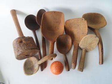 Grouping of early country treenware including a burlwood mallet, 2 serving ladles, 5 butter paddles