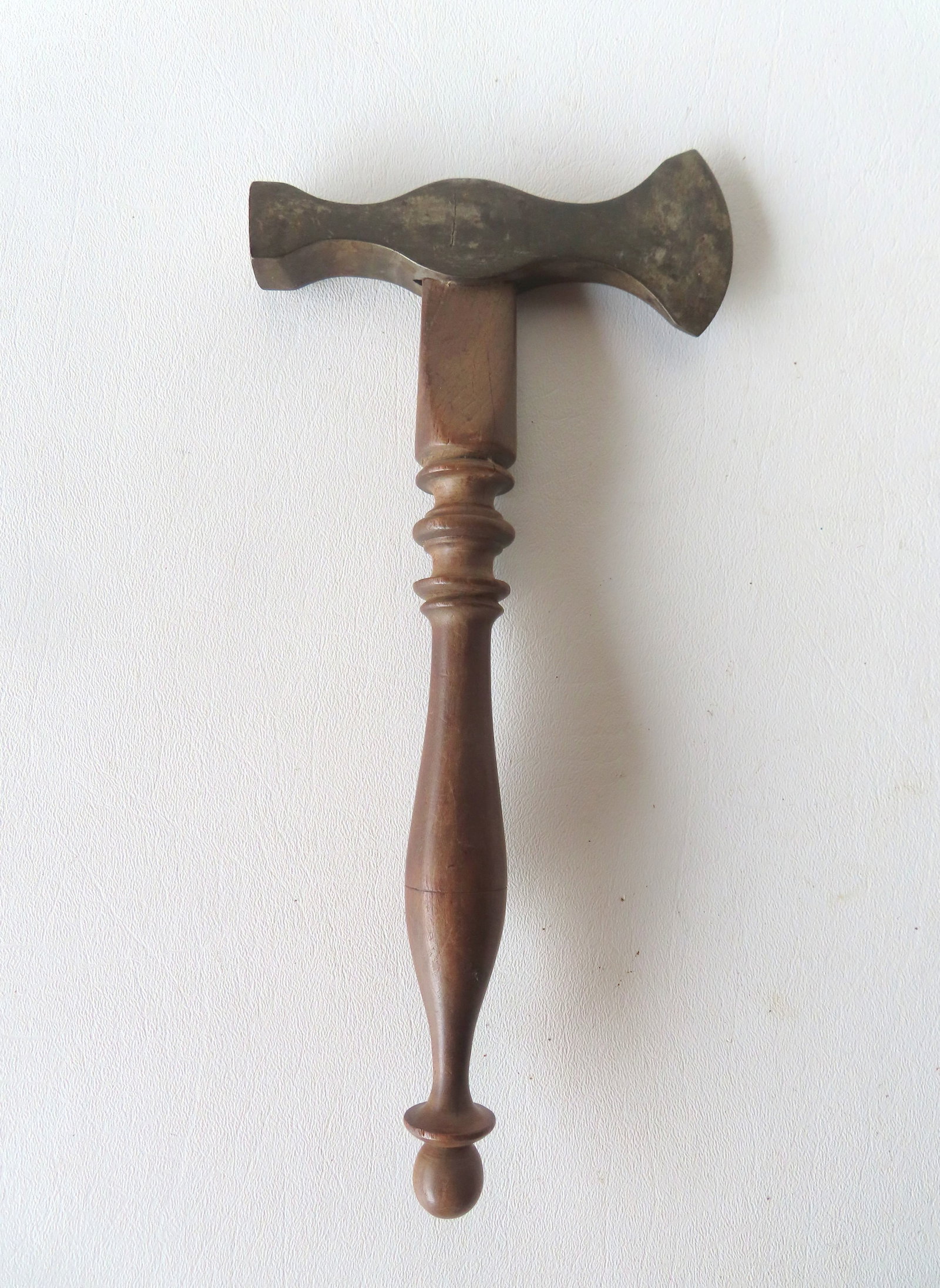 A very fine hand made sugar hammer, having a very refined turned black walnut handle and hardened: A very fine hand made sugar hammer, having a very refined turned black walnut handle and hardened steel head with the makers initials hammered into cheek marked "M R". Slight use wear to handle, and l