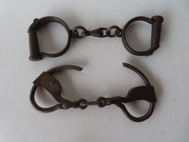 Two pair of iron handcuffs believed to be late 19th century, both lacking keys otherwise very good