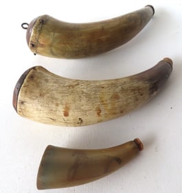 Two powder horns & a horn shot flask. The first a 19th century horn (powder flask) decorated with