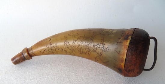 A folk art powder horn with extensive scrimshaw work including signed "J. C. Watson's Horn / April