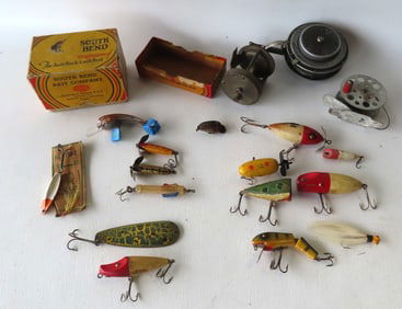 A grouping of vintage fishing lures and fishing reels, most early 20th century. Includes: 10 fishing