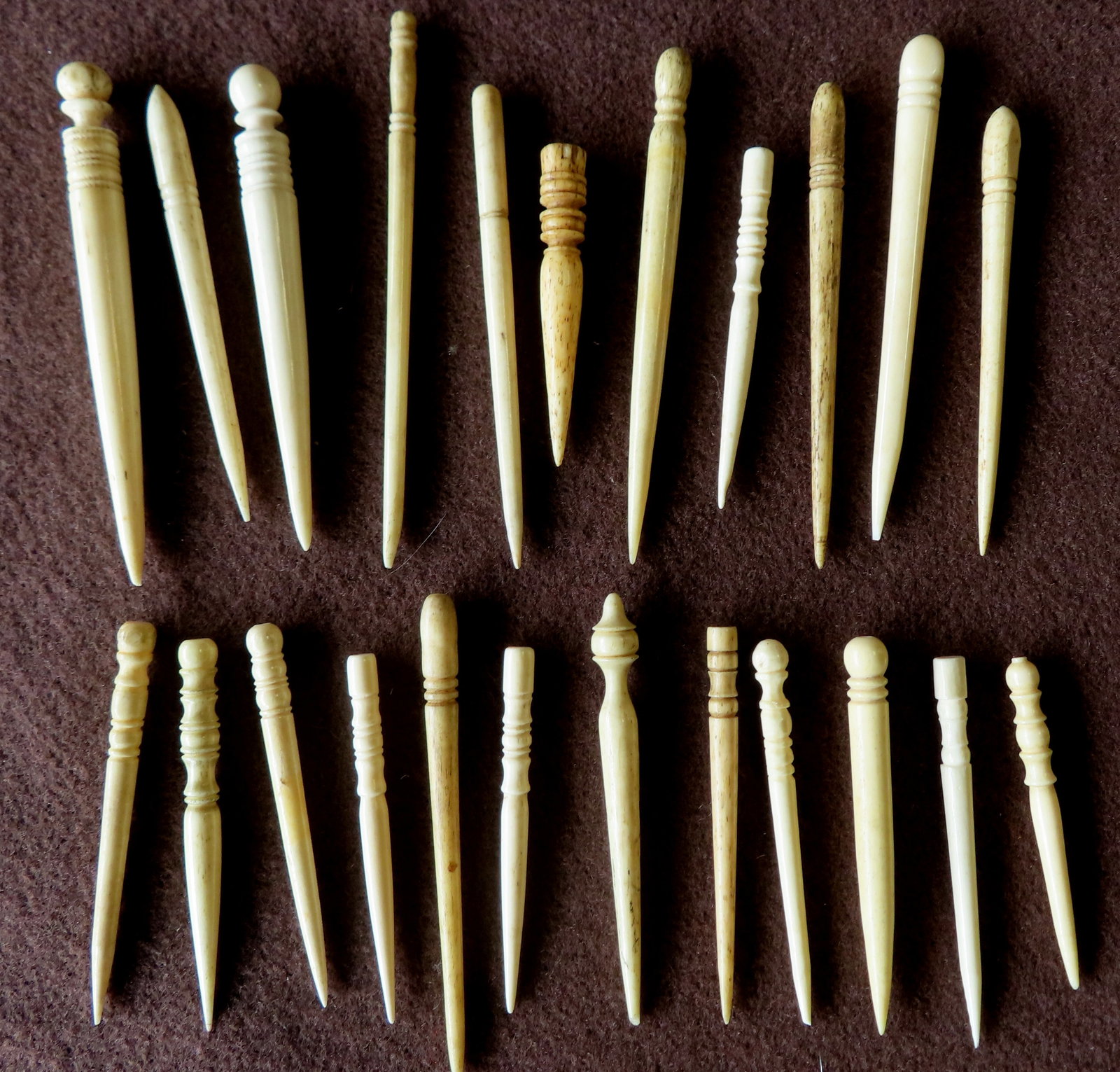 Grouping of 22 whalebone and ivory bodkins, and 1 pipe tamper, 19th century.: Grouping of 22 whalebone and ivory bodkins,and 1 pipe tamper, 19th century. The largest 4 1/8"L. All with use wear and patina consistent with age, and in good condition. Sold by authority of the NY St