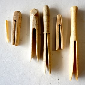 Five whalebone clothes pins, light use wear and in good overall condition, circa 1880-1900. The larg
