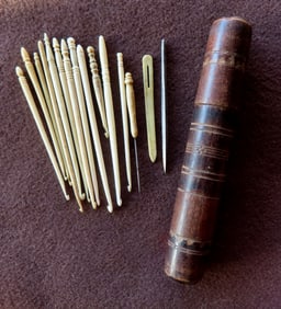 Grouping of 14 whalebone and ivory crochet hooks and awls, plus 1 metal awl.