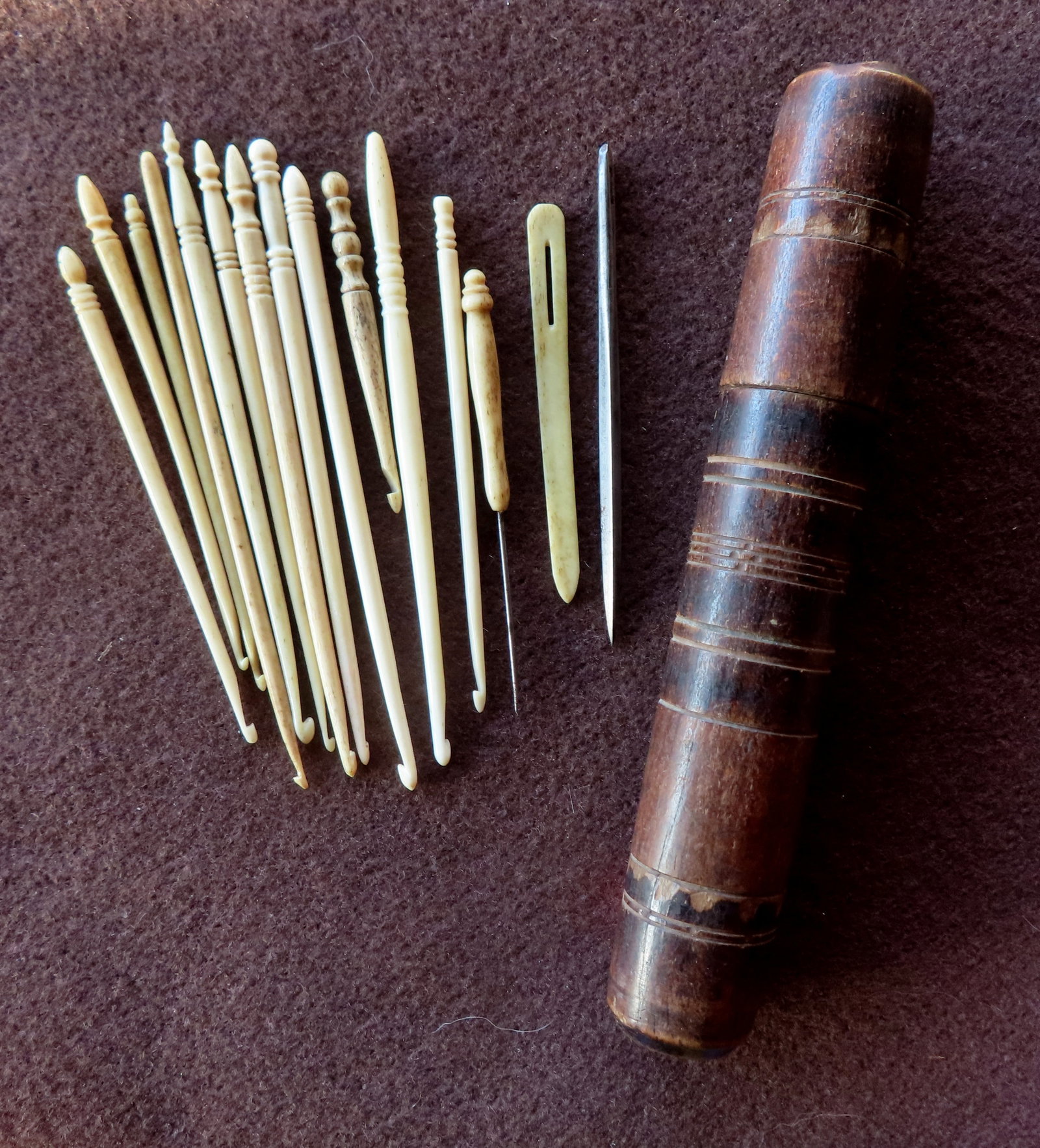 Grouping of 14 whalebone and ivory crochet hooks and awls, plus 1 metal awl.: Grouping of 14 whalebone and ivory crochet hooks and awls, plus 1 metal awl. One with loss to base, all others with patina and use wear consistent with age, mid to late 19th century in very good condi
