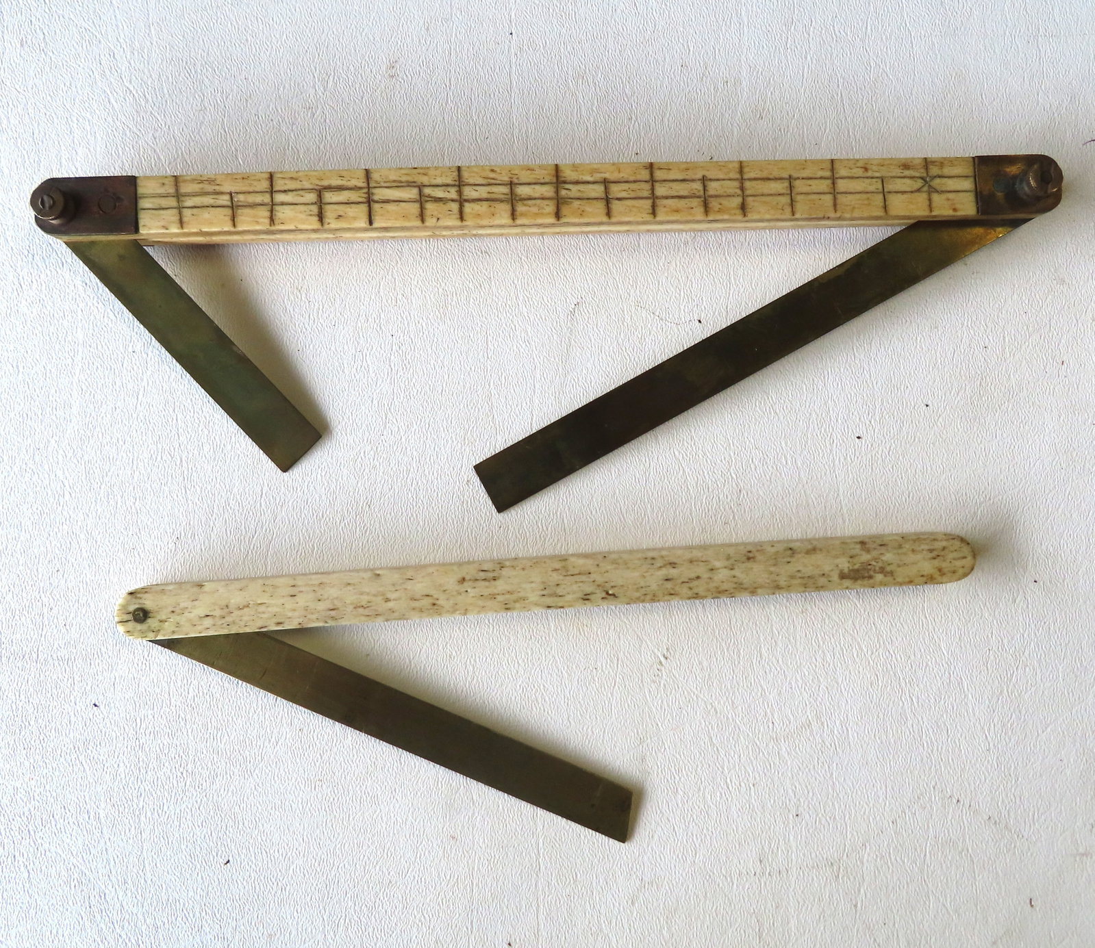 Two whalebone nautical measuring instruments.: Two hand made whalebone nautical bevel gauges, one also doubles as a ruler, all with good patina and use wear consistent with age, early to mid 19th century. Provenance: From the estate of Jeff Raymon