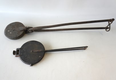 Two early hearth waffle irons, Pennsylvania. The first, hand forged, with tulip design with leaves -