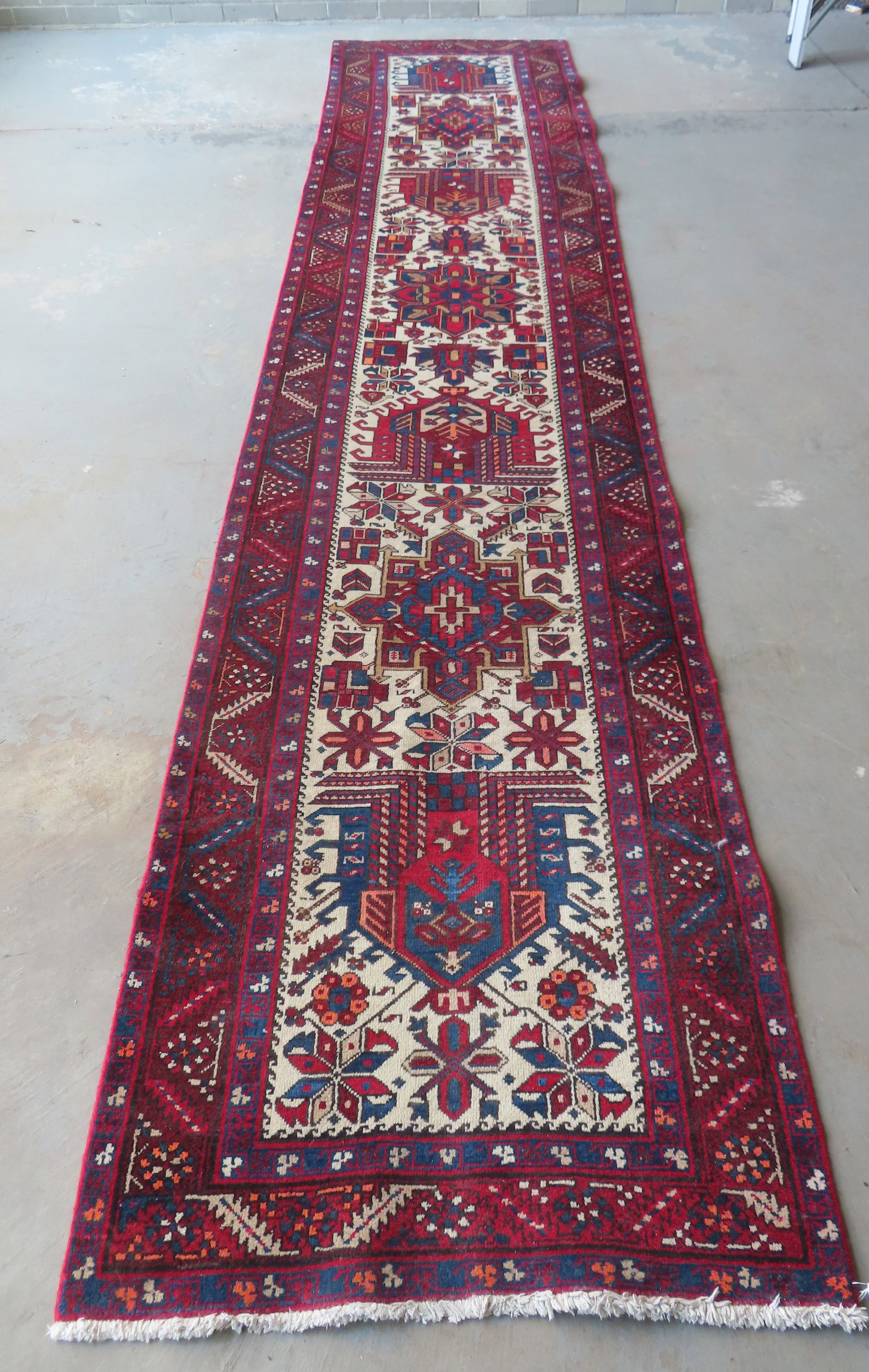 An oriental runner, hand woven, 20th century, excellent condition with little or no wear. Measures: An oriental runner, hand woven, 20th century, excellent condition with little or no wear. Measures 14' 8 1/2"L x 3' 1 1/2".