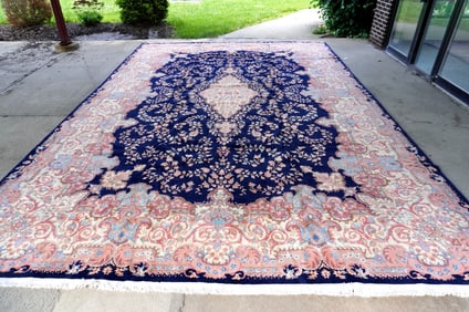 An oriental room size rug, hand woven, 20th century, excellent condition. Measures 12' 7" x 17' 8".
