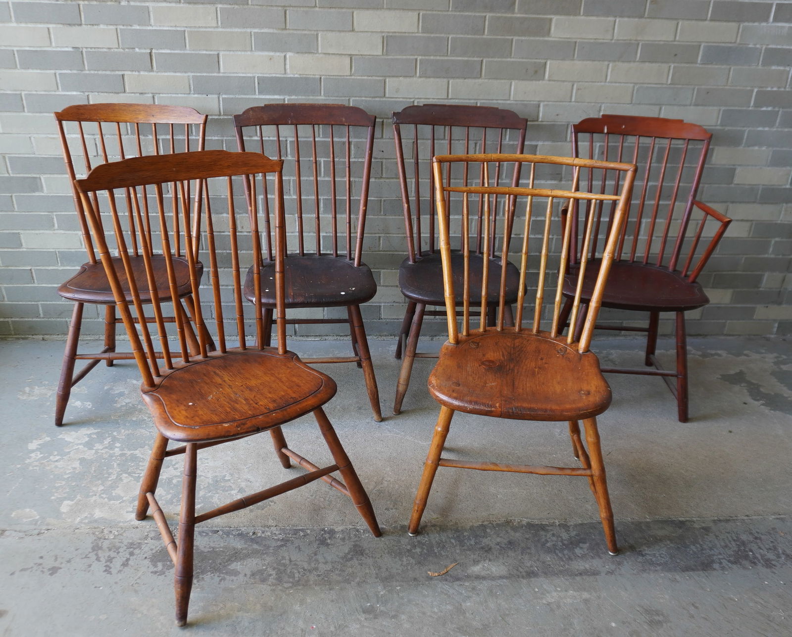 Grouping of 6 period Windsor chairs, 5 near matching stepdown, and 1 birdcage. All refinished with: Grouping of 6 period Windsor chairs, 5 near matching stepdown, and 1 birdcage. All refinished with some use wear but good condition. Late 18th century.