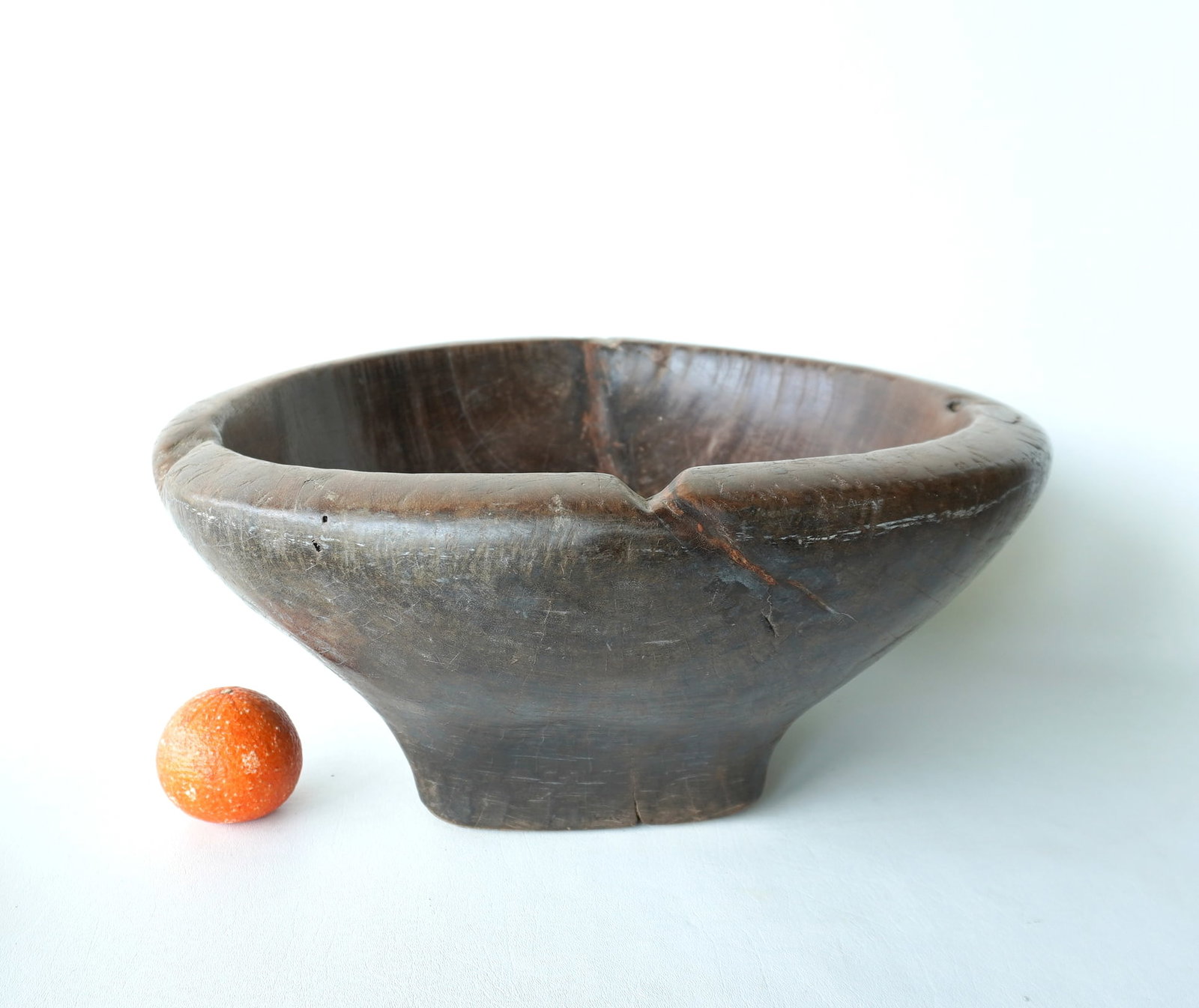 A large primitive European burl wood bowl, hand dug, heavy construction, old use wear and age check,: A large primitive European burl wood bowl, hand dug, heavy construction, old use wear and age check, but overall good condition, 18th century or earlier. Measures 19" diameter x 9"H. Provenance: From 