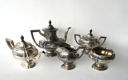 T.S. & Co. sterling silver 5 piece tea service including teapot, coffee pot, waste bowl, and lidded