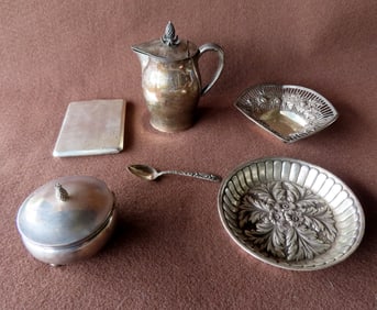 A grouping of Sterling silver including: A Cartier milk pitcher with pineapple finial - 5 1/4"H; a