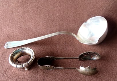 Three pieces of sterling silver. The first, a large Mexican ladle - very good condition - measures