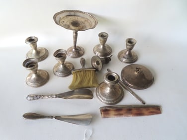 Grouping of sterling silver accessories including candlesticks, brushes, 2 shoe horns (both with