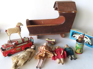 Grouping of small toys and dolls including: A small 19th century shoulder head doll in costume -