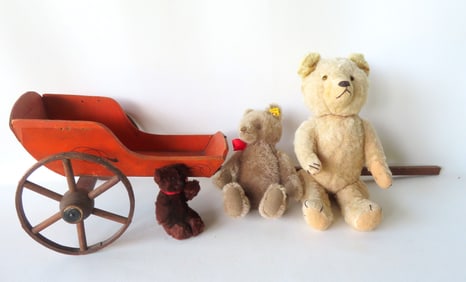 Grouping of vintage toys including: A hand painted doll's pull cart with wooden wheels in original