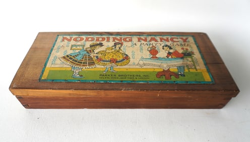 A "NODDING NANCY" party game in original box by Parker Brothers - this is a ring toss game with