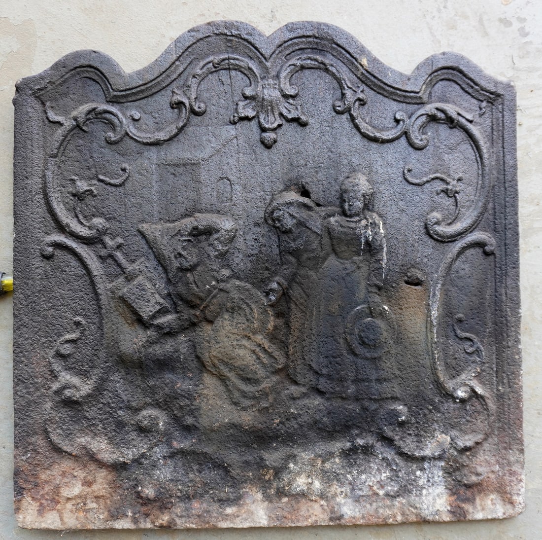 A cast iron fireback, religious scene, 18th century.: A cast iron fireback, religious scene. Some pitting and imperfection in casting including 2 small holes, probably 18th century. Measures 25 3/8" square. Provenance: From the estate of George Pouder, w