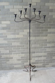 A very fine Arts & Crafts hand forged iron floor standing candelabra, with 7 lights,
