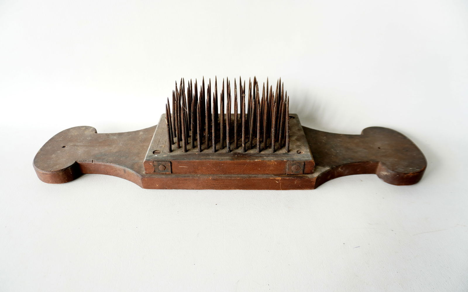 A good primitive hatchel in original finish, early 19th century.: A good primitive hatchel in original finish, early 19th century, very good condition. Measures 26 1/2"L x 6 7/8"W. Provenance: From the Marni Bakst and William Sadler collection of antiques, Verbank N