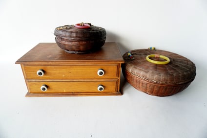 Grouping of sewing related collectibles including a 2 drawer spool cabinet with 2 drawers