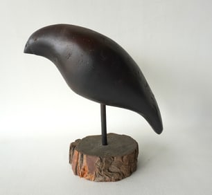 A modernistic wooden bird carving signed D. Franklin, in original black paint.