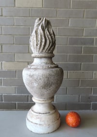 A carved marble or limestone finial in the form of a torch extending from bulbous turned base, mid