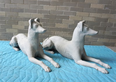 Two very fine cast iron life size recumbent greyhound garden sculptures, late 19th to early 20th