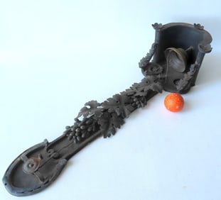 A folk art make-do brass and iron door or dinner bell, 19th century. The frame is all hand made iron