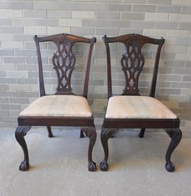 Two near matching mahogany Chippendale side chairs with ball and claw feet, acanthus carved legs,