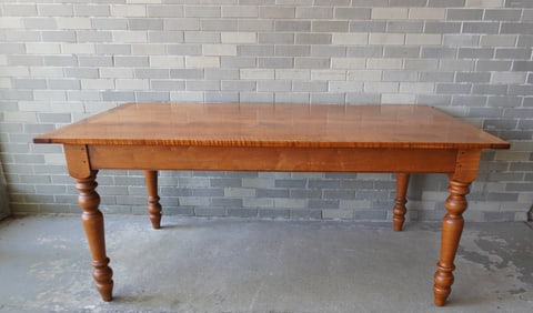A Leonard's custom made tiger maple farm table with turned legs and breadboard ends. Signed in 2